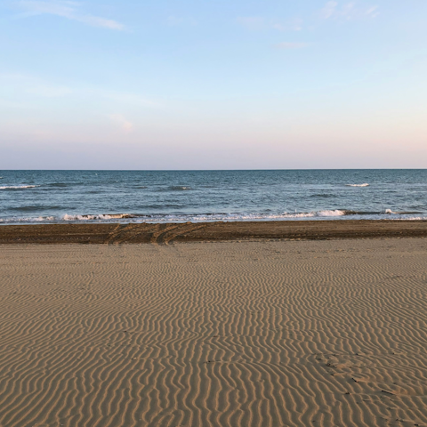 Sunbathe on the sand at Plage du Soleil, eight-minute walk away
