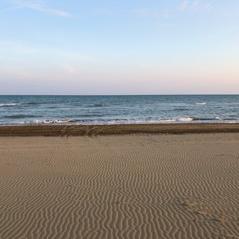 Sunbathe on the sand at Plage du Soleil, eight-minute walk away