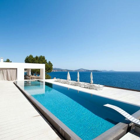 Admire stunning sea views while swimming in the pool