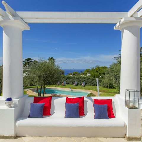 Admire the sea views on the terrace, glass of wine in hand