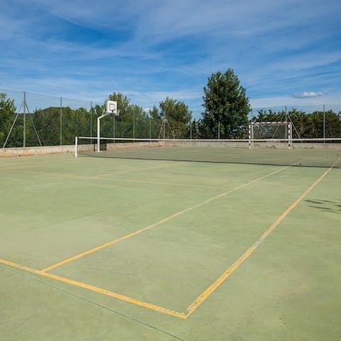 Show off your powerful serve on the villa's very own tennis court