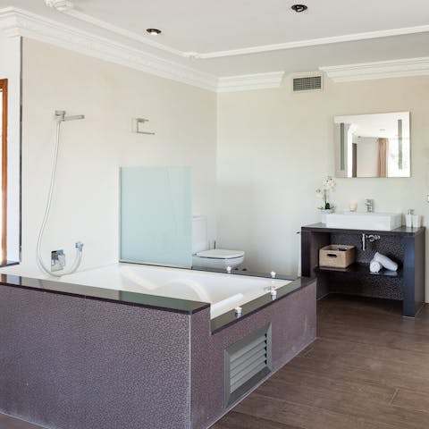 Close your eyes and relax in the master bedroom's Jacuzzi bathtub