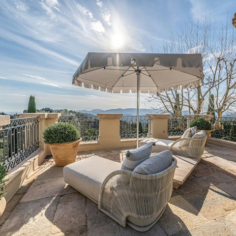 Take a glass of wine out to the terraces