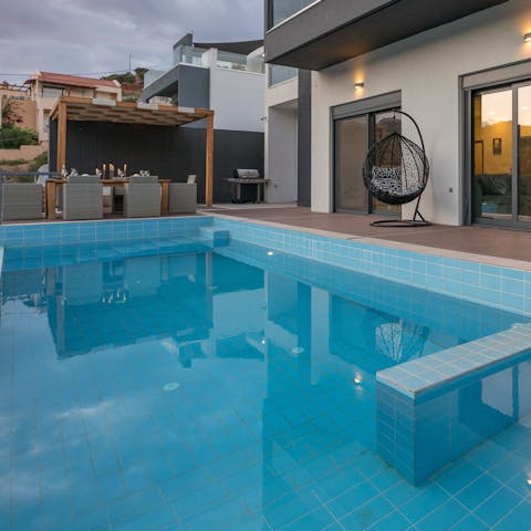 Watch the children play games in the private pool while you laze on the loungers