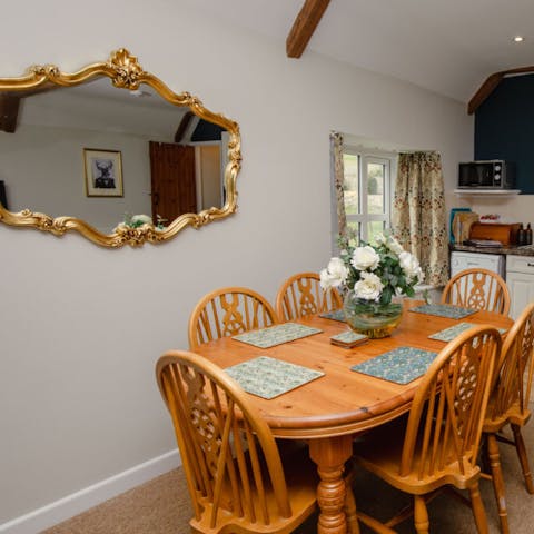 Enjoy home-cooked meals around your quaint dining setup, complete with William Morris placemats