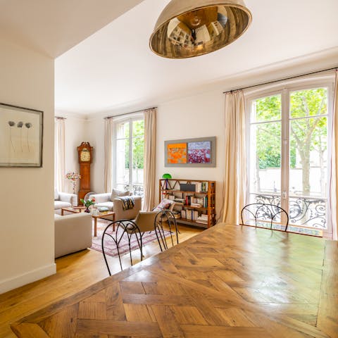 Take in floor-to-ceiling views of the leafy street below