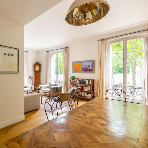 Take in floor-to-ceiling views of the leafy street below