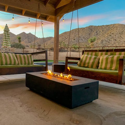 Unwind on the lounge swings in front of the fire