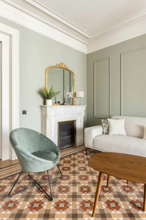 Unwind in the living room with original geometric floors
