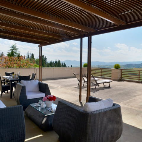 Enjoy a glass of Prosecco in the shade on the private terrace