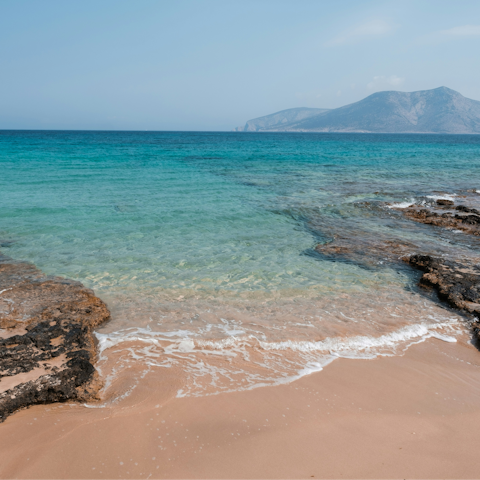 Spend the afternoon sunbathing on Agios Prokopios Beach, a short drive away