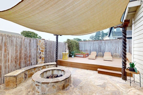 Light the fire pit as evening settles over the deck