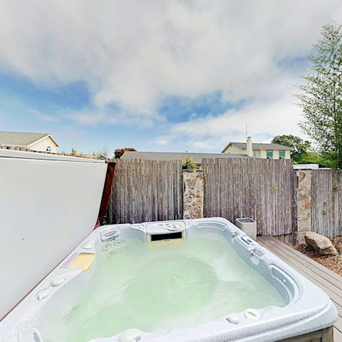 Wind down in the hot tub after a busy beach day