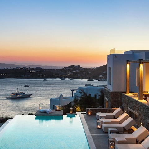 Glide gracefully through the infinity pool and watch the sunset from the loungers