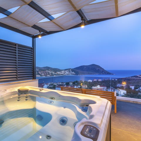 The outdoor jacuzzi with a covered canvas roof perfect for unwinding come rain or shine