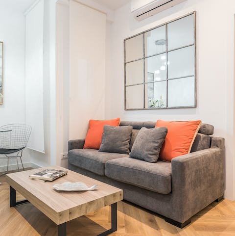 Kick back in the laid-back living area with a glass of Spanish wine after a day spent touring the city