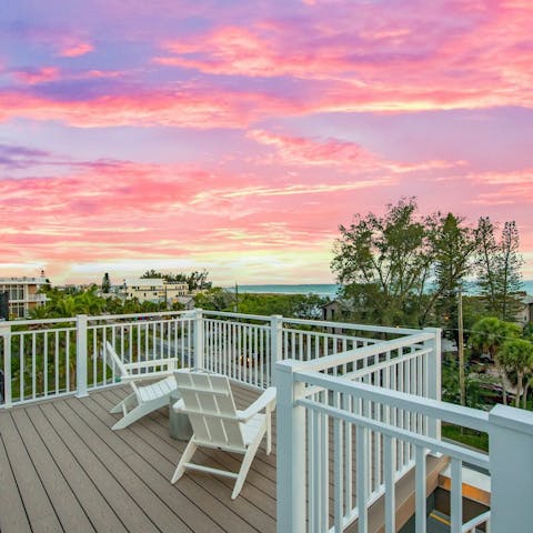 Watch the sun go down over a glass of wine on the balcony