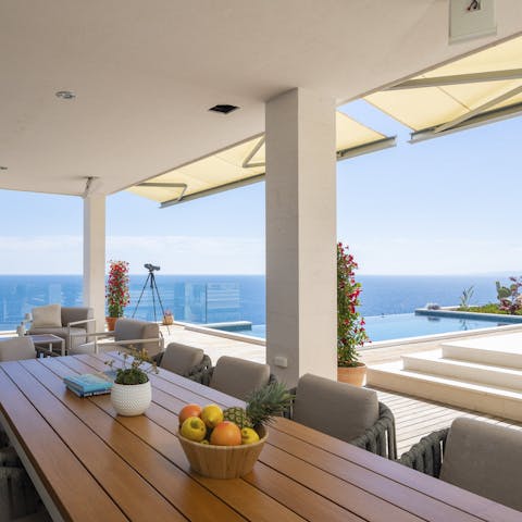 Dine alfresco and admire the stunning sea views in the shade of the terrace
