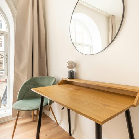 Catch up on emails from the bedroom's desk space