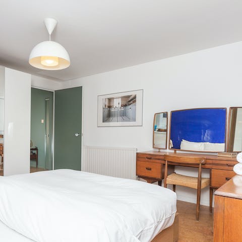 Catch up with your emails on the vintage desk in the bedroom