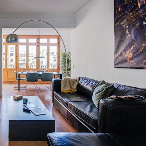 Recline on the huge L-shaped sofa in the bright living room