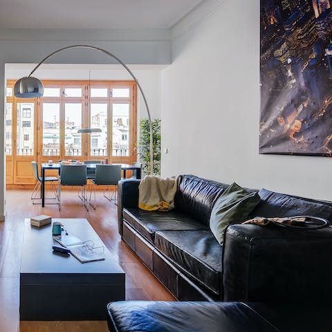 Recline on the huge L-shaped sofa in the bright living room