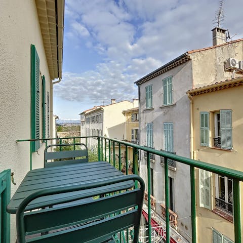 Sip red wine while admiring the old town view