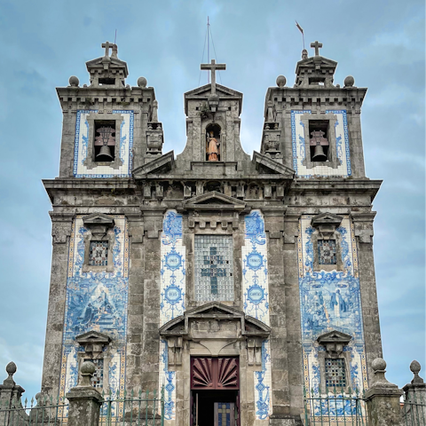 Visit the azulejo-tiled Church of Santo Ildefonso, a five-minute walk away