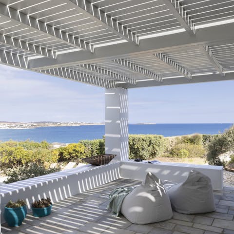 Relax under the sun-dappled pergola with your holiday read