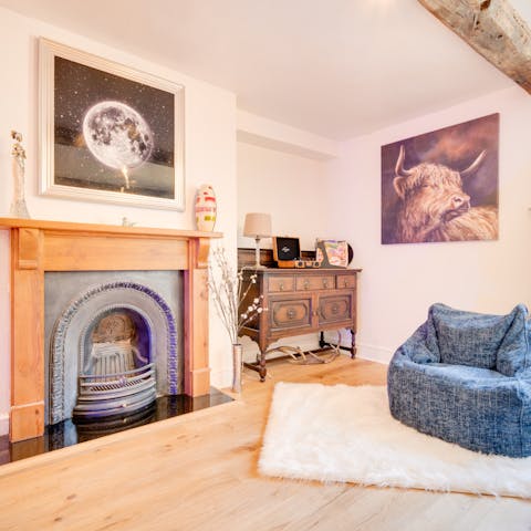 Curl up in the living room and enjoy a glass of wine with the crackling fire