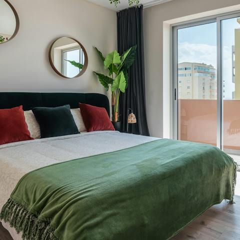 Sleep soundly in the comfortable main bedroom, with patio doors to the outside space