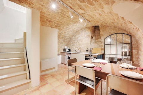 Dine beneath centuries-old stone arches in Saint-Germain-des-Prés