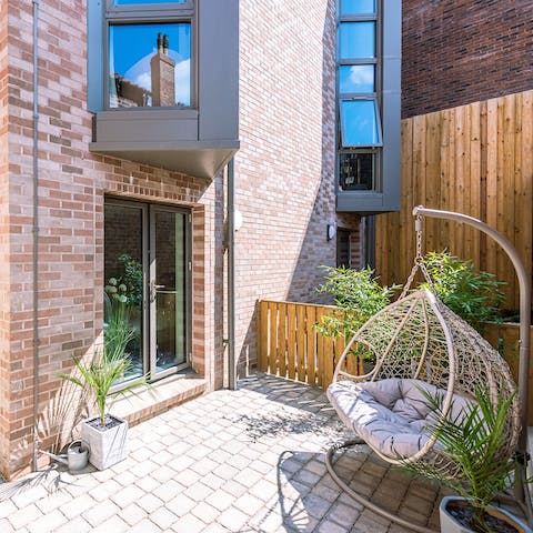 Spend sunny summer days gently swaying in the swing chair