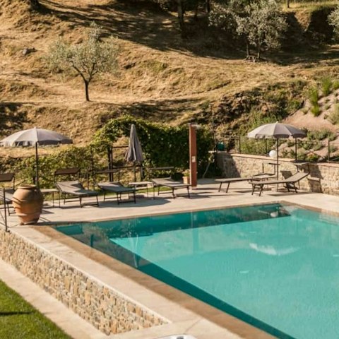 Lounge around the pool on a hot Tuscany day