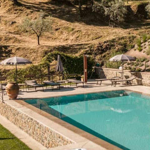 Lounge around the pool on a hot Tuscany day