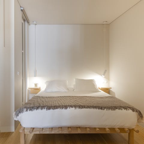 Enjoy a peaceful night's sleep in the wood-accented bedroom
