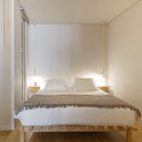 Enjoy a peaceful night's sleep in the wood-accented bedroom