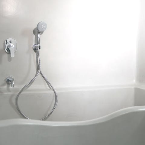 Unwind in the bathtub after a fun-filled day of discovering Santorini