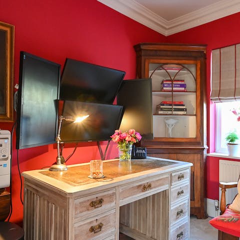 Geek out over the four-monitor set-up in the home's workspace