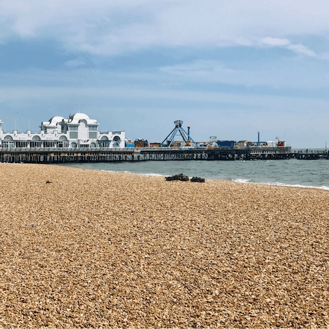 Dip your toes in the sea before strolling along South Parade Pier