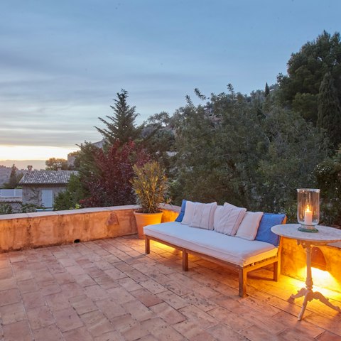Enjoy sangria on the terrace while the sun goes down