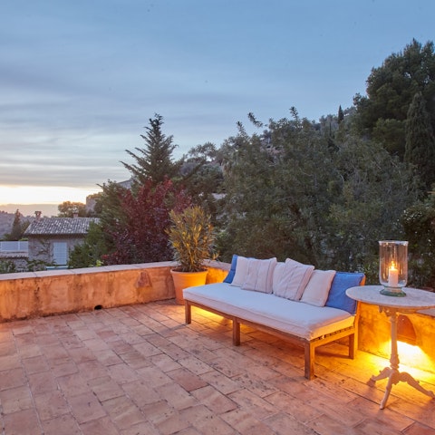 Enjoy sangria on the terrace while the sun goes down