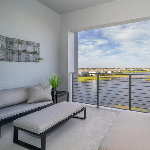 Wind down on the terrace with a drink and a lake view