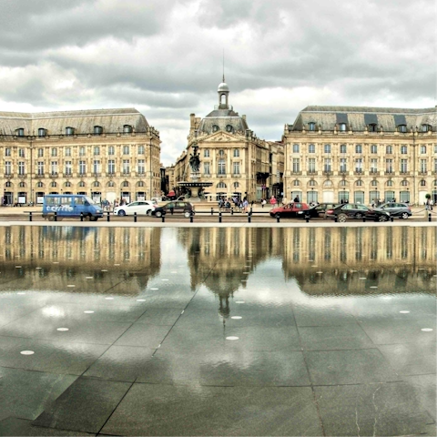 Stroll into the historic centre of Bordeaux until you reach Place de la Bourse and Miroir d'eau