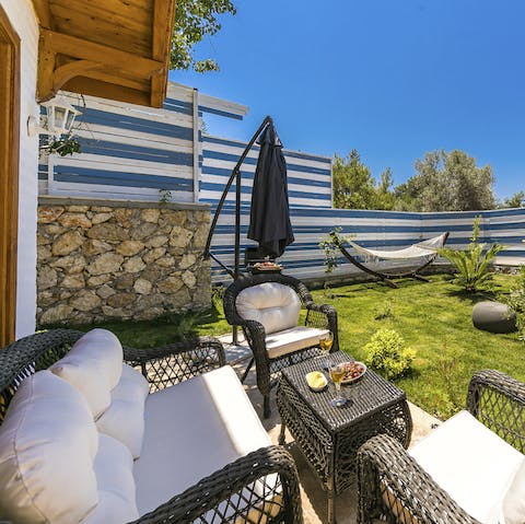 Relax with a drink as the sun goes down