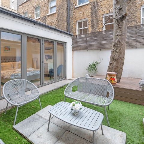Spend sunny afternoons in the private patio garden