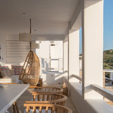 Swing about in your wicker egg chair, the perfect reading spot - although you'll probably get distracted by the view!