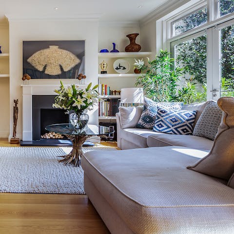 Light the fire and spend cosy evenings in the art-filled living room
