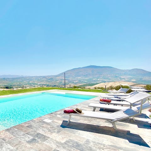 Relax on a poolside lounger or take a refreshing dip in the private pool
