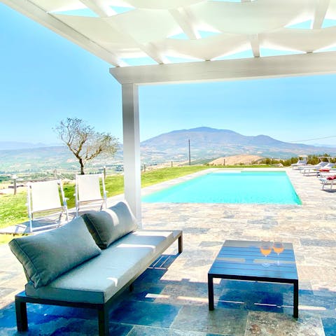 Gaze out at mountain views from the covered terrace
